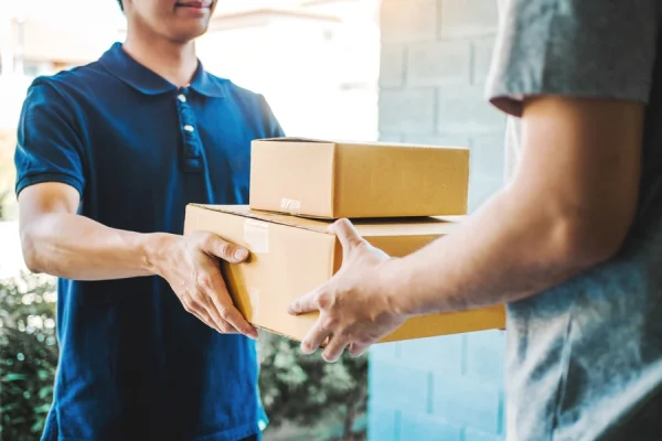 courier handing parcel over